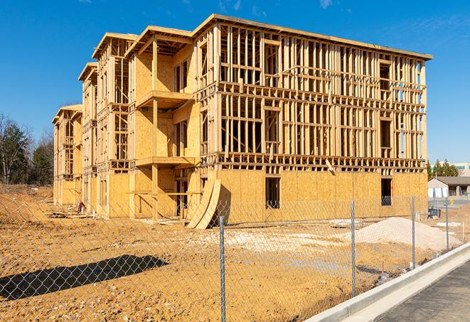 a job site enclosed by temporary chain link fences, ensuring safety for workers and pedestrians in West Friendship, MD